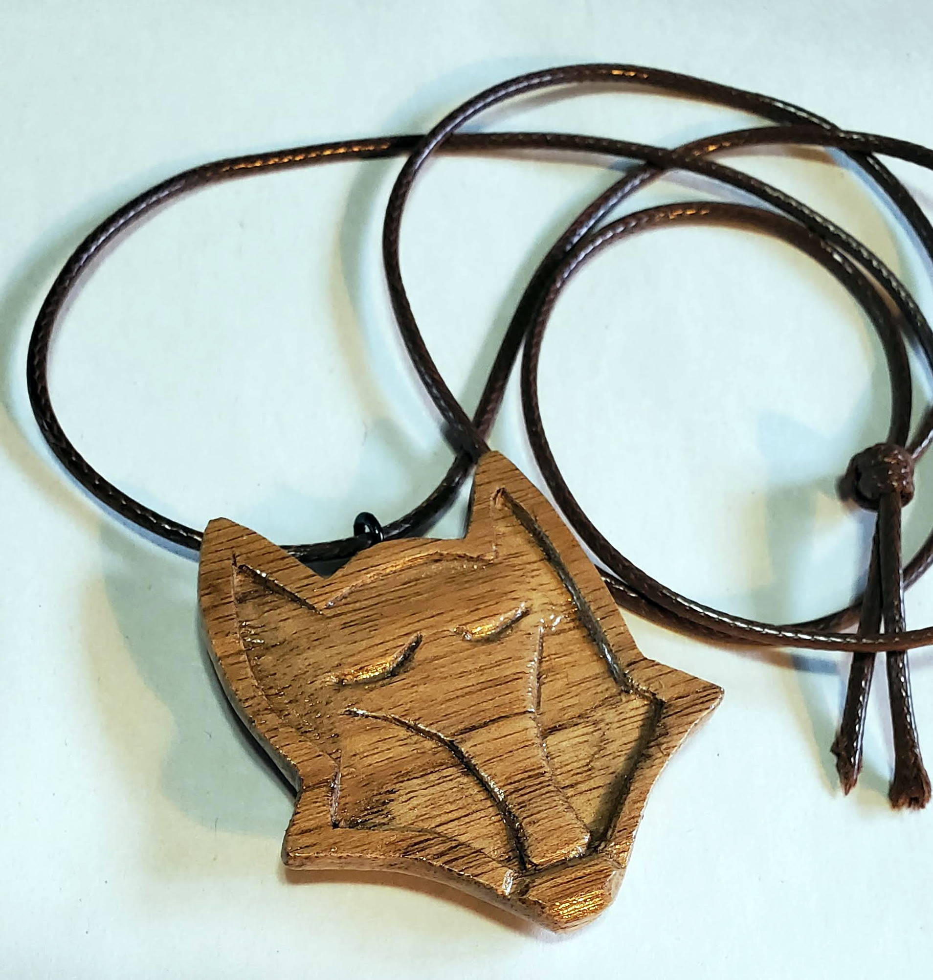 hand carved stylized fox pendant