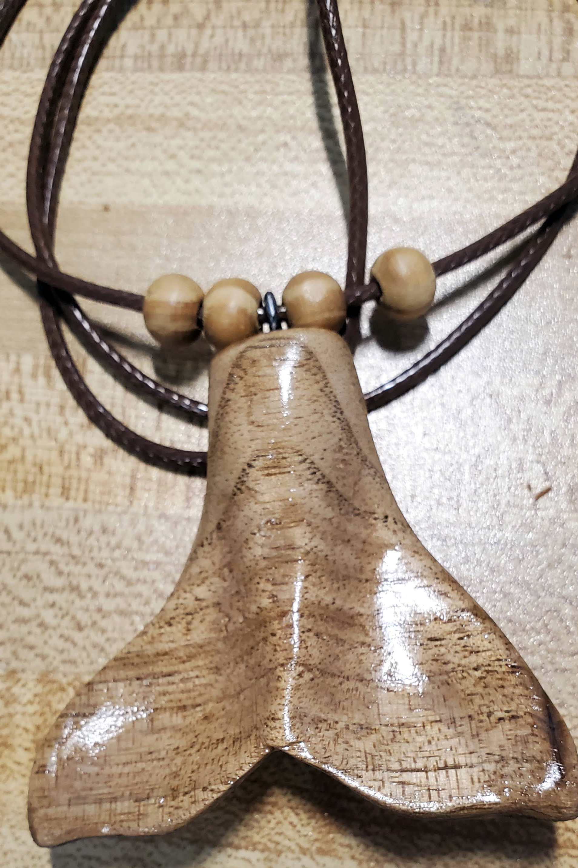 hand carved wale tail pendant